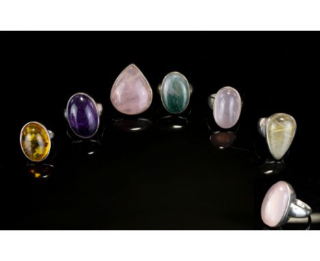 A Collection Of Silver And Crystal Set Rings Six items in total to include large rose quartz oval cabouchon, teardrop shaped 