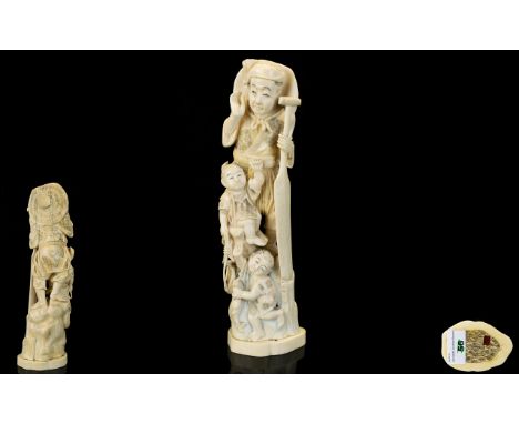 Japanese - Signed Meiji Period Tokyo School Finely Carved Ivory Okimono Figure Group - Fisherman with Two Children, One Holdi