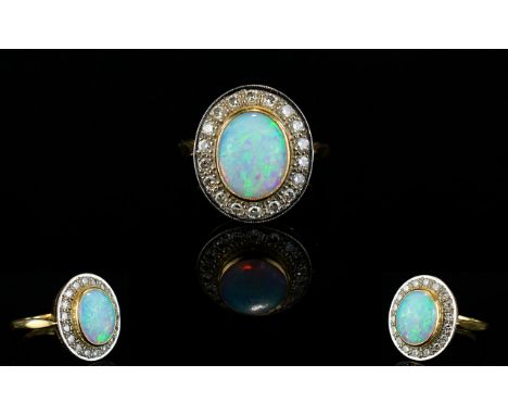 18ct Gold Diamond and Opal Set Dress Ring of Excellent Form. Fully Hallmarked. The Central Cabouchon Cut Opal Surrounded by 2