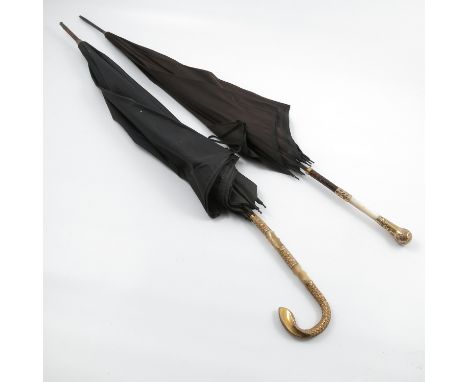 A C.R.H black umbrella, with mother of pearl handle and 18ct gold plated mounts, together with another similar black umbrella