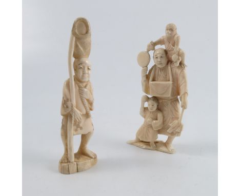 A carved ivory model, of an Oriental man with a child standing beside him and a monkey on his shoulder, height 5.5ins and ano