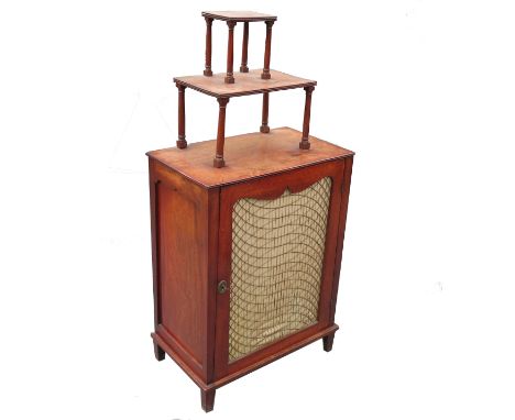 A 19th century mahogany cupboard, having a carved two shelf supastructure with a brass grilled cupboard below