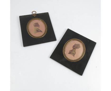 Foster, a pair of framed oval portrait silhouettes, of a man and a woman in black and gold, signed and dated 1823, in black p