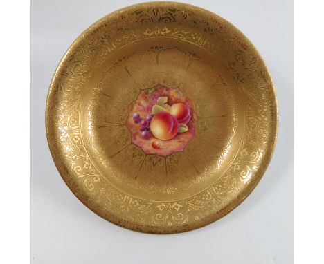 A Royal Worcester shallow bowl, with acid etched border, the centre decorated with fruit to a mossy background by Skerett, di