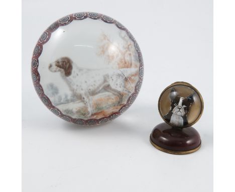An antique Essex crystal or reverse carved intaglio, of a dog, mounted as a menu holder, height 1.75ins, together with a pape