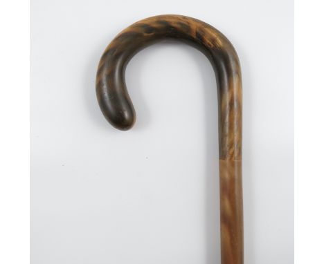 A horn walking stick, the shaft made in sections, with scroll handle, height 35ins