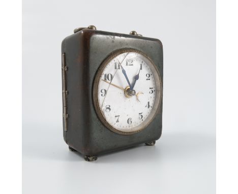 A metal cased travelling clock, with grey metal case and white enamel dial, height including handle 4ins