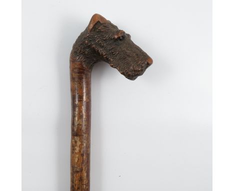 A walking stick, the handle carved with a Fox Terrier mask, height 36ins