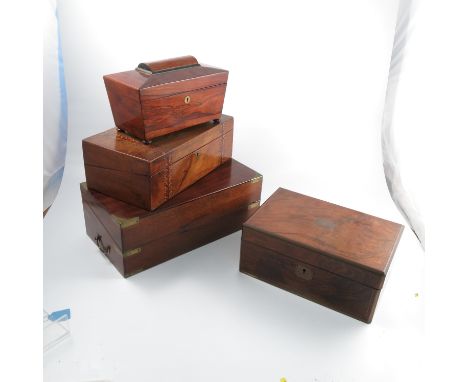 A 19th century rosewood sarcophagus tea caddy, the interior fitted with two canisters and central well, width 11.5ins, togeth