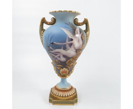 A Royal Worcester vase, the front decorated with four swans in flight and gilt foliage to a powder blue ground by C H C Baldw