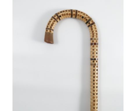 A 19th century marine vertebrae walking stick, with scroll handle and horn sections, height 35ins