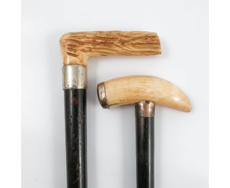 A 19th century marine ivory handled walking stick, with ebonised shaft and silver mounts, London 1890, together with ivory ha