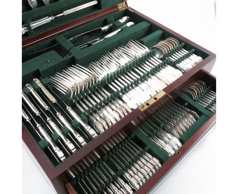 A cased 87 piece canteen of silver cutlery, in the Chippendale pattern, comprising 8 dinner knives, 8 dessert knives, carving
