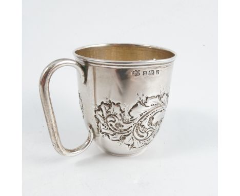 A silver mug, with embossed leaf decoration, having a gilt wash interior, Birmingham 1902, weight 1oz
