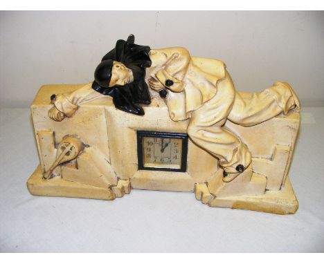 A Pierrot mantle clock.