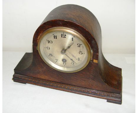 A wooden cased mantle clock.