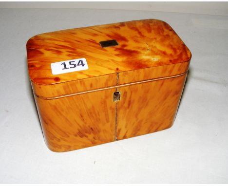 A wooden and possibly tortoise shell veneer tea caddy, opening to reveal to felt lined compartments, measuring 16.5cm wide.