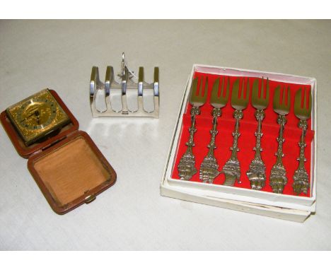 A sterling silver toast rack, Swiza alarm clock & set of Dutch silver plated forks.