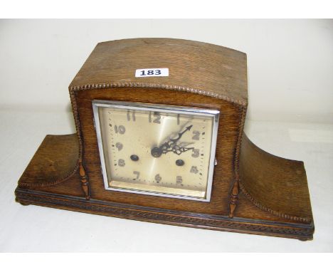 A wooden cased mantle clock.