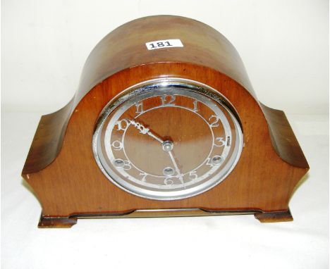 A wooden cased mantle clock.