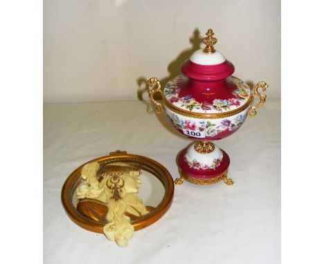 A porcelain vase & cover (AF), with sea horse gilt handles & paw feet, measuring 28cm tall & a ladies portrait mirrored wall 