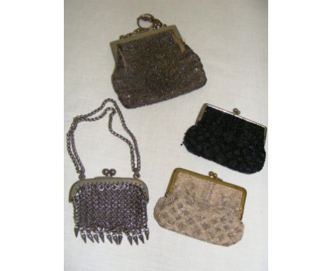 Four vintage purses including a white metal example.