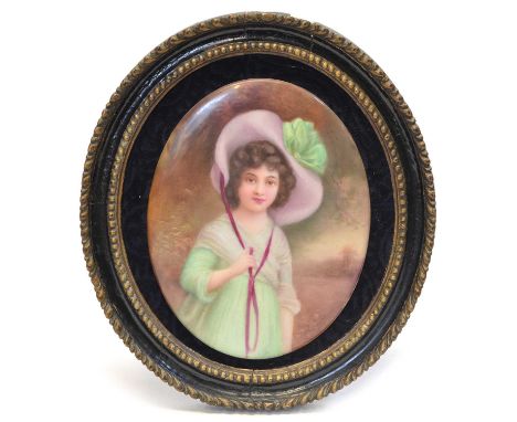 Painted Porcelain Plaque Leslie Johnson Early 20th Century framed oval porcelain wall plaque with a painted portrait of a you