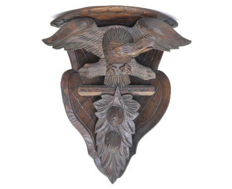 Black Forest carved corner bracket Black Forest carved corner bracket shelf, with eagle decoration45cm high