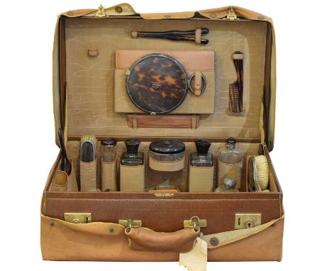 A 1920s travelling fitted toilet set by Mappin & Webb, A 1920s travelling fitted toilet set by Mappin & Webb, containing a si