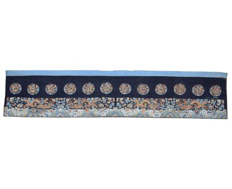 Chinese embroidered panel Early 20th Century Chinese embroidered long panel on a dark blue silk ground with wirework dragon e