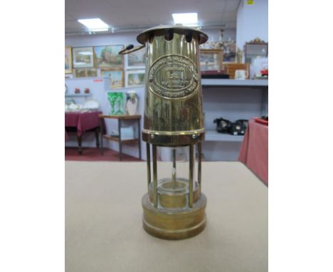 A Brass Miners Lamp by Thomas &amp; Williams of Aberdare, 25cm high with handle down.