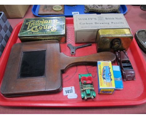 Marbles, tins, Wolff's carbon drawing pencils, Dinky Lagonda, other die cast vehicles, mahogany handled red glass panels:- On