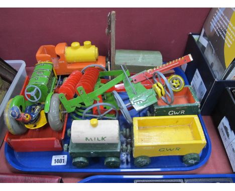 A Mid XX Century Tinplate Mettoy Tractor and Implement Set, plus driver; together with a handmade wooden tram set.