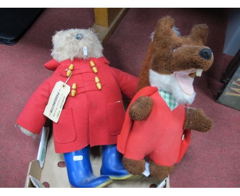 A Paddington Bear Soft Toy, wearing a red duffle coat and blue wellington boots, (lacking hat); together with a Wendy Boston 