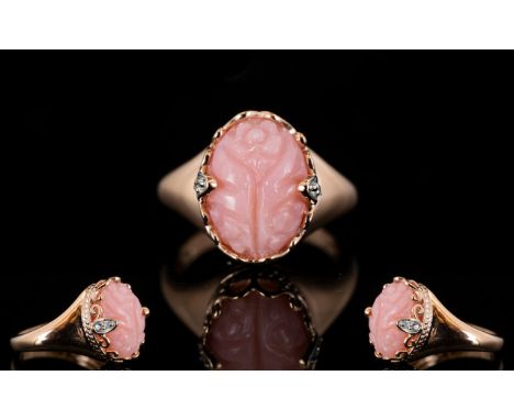 Pink Opal Hand Carved Ring, an oval cut pink opal of 4.5cts, mined in Peru, hand carved with a floral motif, in a decorative 