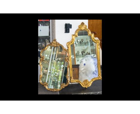 Two Yellow Gilt Frame Rococo Style Mirrors Each in very good, as new condition, the first with waved fluted frame and trimmed