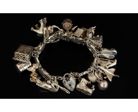 A Silver 4 Bar Gate Bracelet Loaded with 22 Old Silver Charms. All Marked for Silver From The 1950's, Assorted Subjects, Some