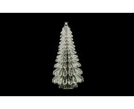 A Lead Crystal Christmas Tree Centrepiece Large faceted glass model with cut crystal star to top, raised on circular base wit