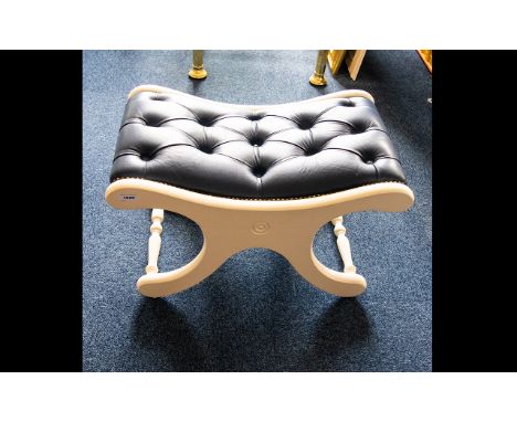 X - Framed Concave Footstool - royal blue leather button rest on white painted frame. 15 inches high, 27 inches long. 
