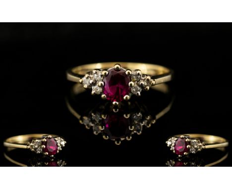 Ladies 9ct Gold - Attractive Ruby and Diamond Dress Ring. The Central Ruby of Good Colour with Diamond Shoulders. Full Hallma