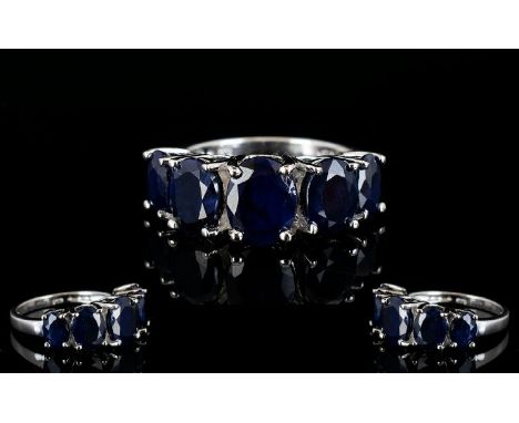 Sapphire Five Stone Band Ring, five oval cut sapphires, graduating down, either side of the centre stone of approximately .4 