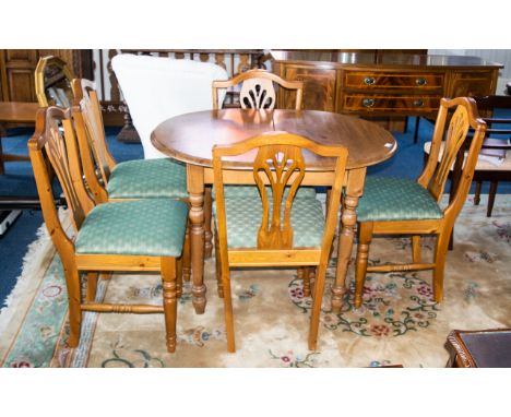 Pine Kitchen Table &amp; Five Chairs. Extending table of oval form with 5 matching chairs, each upholstered in sage green dia