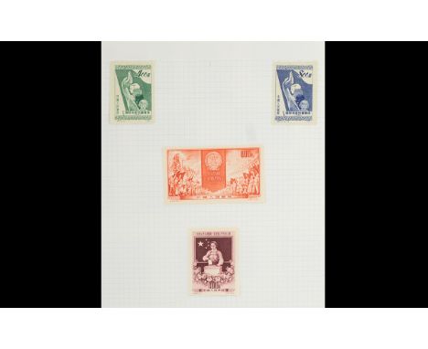 A Collection Of Three Stamp Albums two contain stamps from around the world, including much mint commonwealth, the third albu