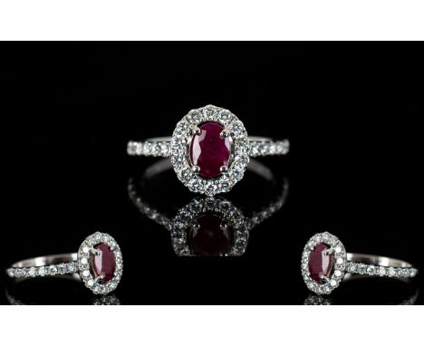 18ct White Gold Ruby And Diamond Cluster Ring Central ruby surrounded by round modern brilliant cut diamonds, diamond set sho
