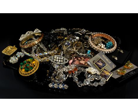 A Mixed Collection Of Costume Jewellery A varied lot to include several paste set brooches, ceramic floral form clip earrings