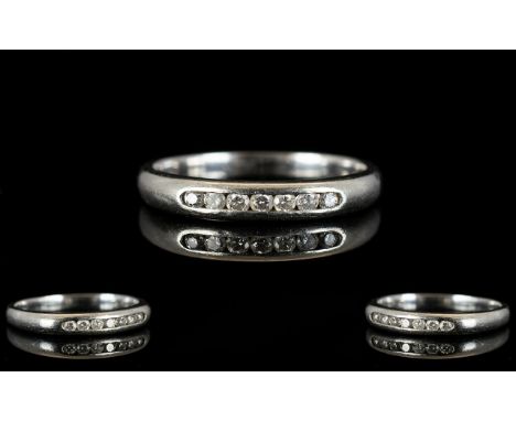 Platinum And Diamond Eternity Ring Channel set with seven round modern brilliant cut diamonds, fully hallmarked, ring size K,