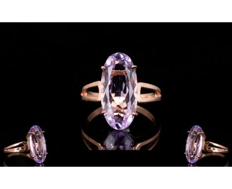 Rose de France Amethyst Solitaire Ring, an elongated oval cut Rose de France amethyst of 8.75cts, set in a plain, split-shoul