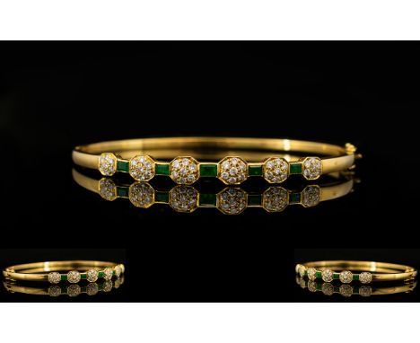 18ct Gold - Attractive Emerald and Diamond Hinged Bangle Set with Six Diamond Flower head Clusters, Each with Emerald Set Spa