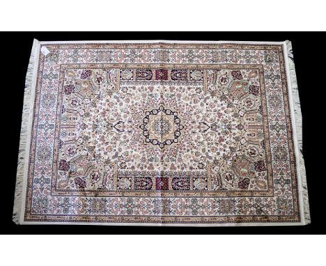 A Large Woven Silk Carpet Keshan rug with beige ground and traditional Middle Eastern floral and foliate border detail with c