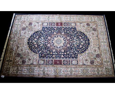 A Very Large Woven Silk Carpet Keshan rug with blue ground and traditional Middle Eastern floral and foliate border detail wi